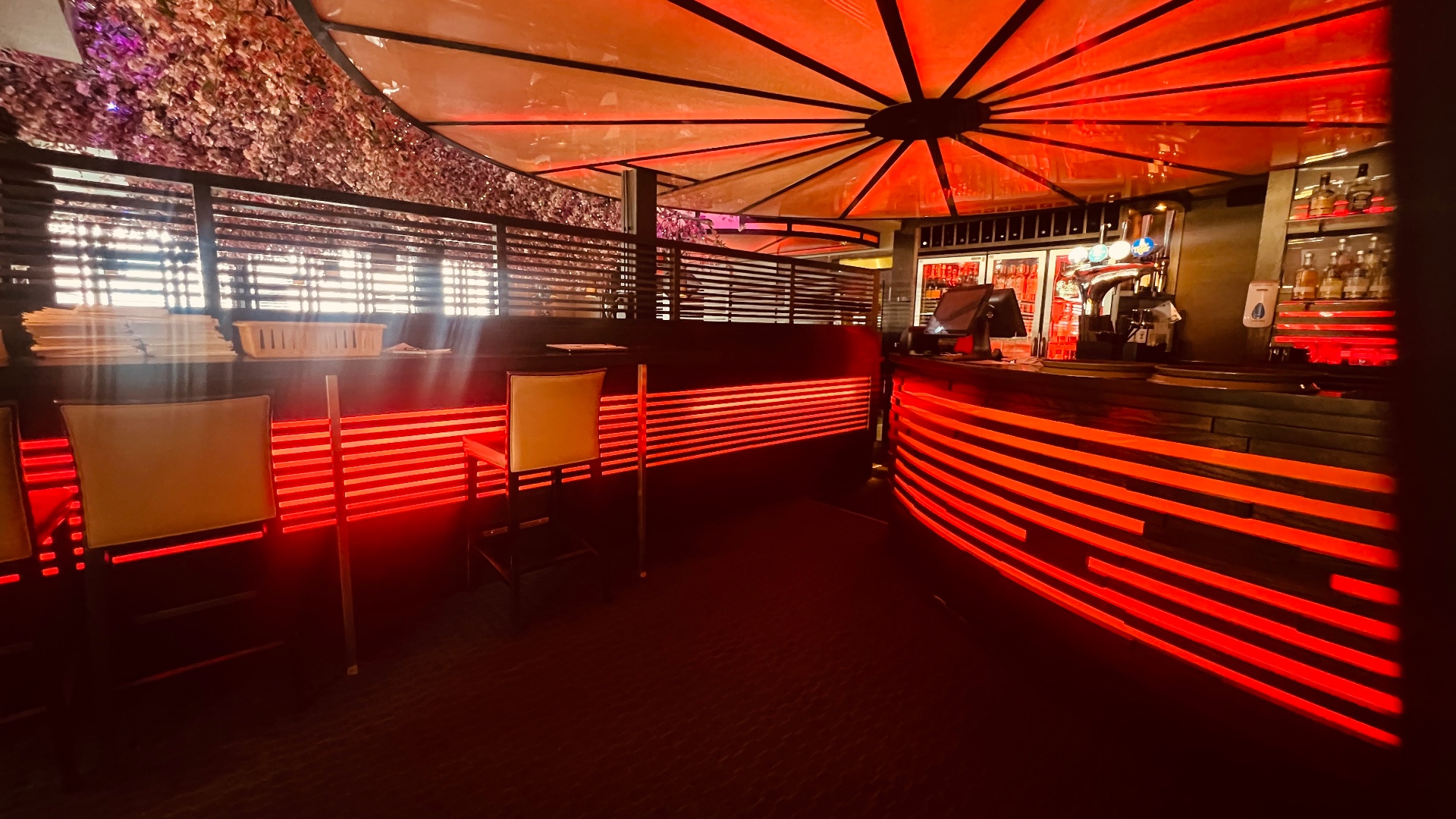 The main interior of Zen with the bar and the oversized red lanterns above.